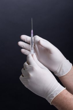 Flicking a syringe