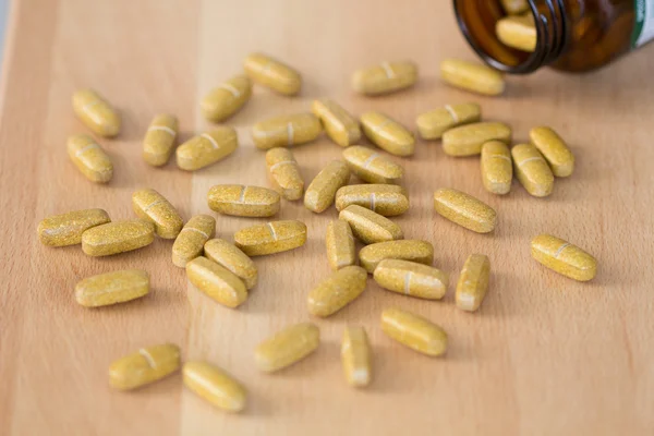 Pills in medicine bottle — Stock Photo, Image