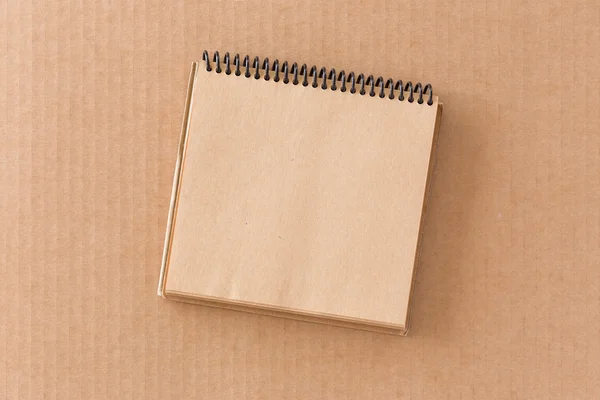 Notepad on cardboard — Stock Photo, Image