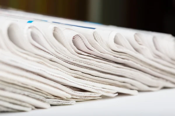 Assortment of folded newspapers — Stock Photo, Image