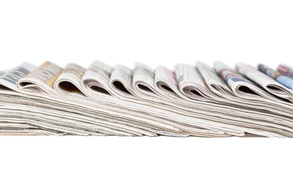 Assortment of folded newspapers isolated on white — Stock Photo, Image