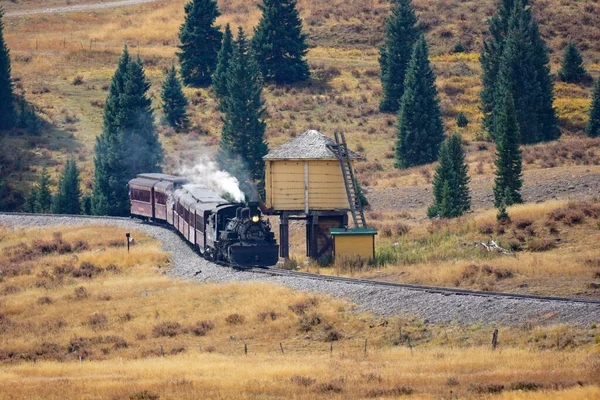 Chama, New Mexico, USA September 28, 2021: Cumbres and Toltec Scenic Railroad getting water from a water tower — ストック写真