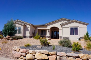 Modern stucco house with drought tolerant landscaping