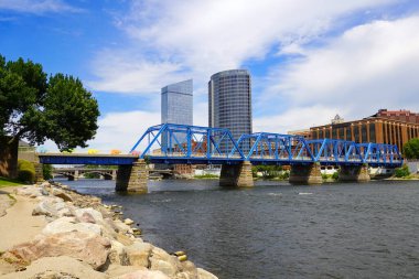 Blue bridge crossing the Grand River in downtown Grand Rapids Michigan
