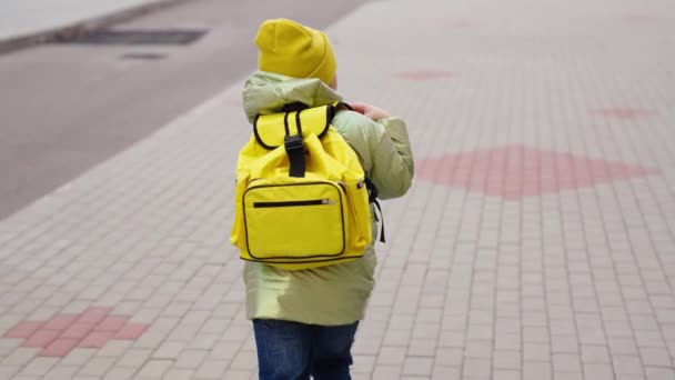 Boy runs school with backpack, school classmate cheerful runner, restless child rushes class for lesson lesson, child victory, preschool education student, happy childhood, kid run yard city school — Video Stock