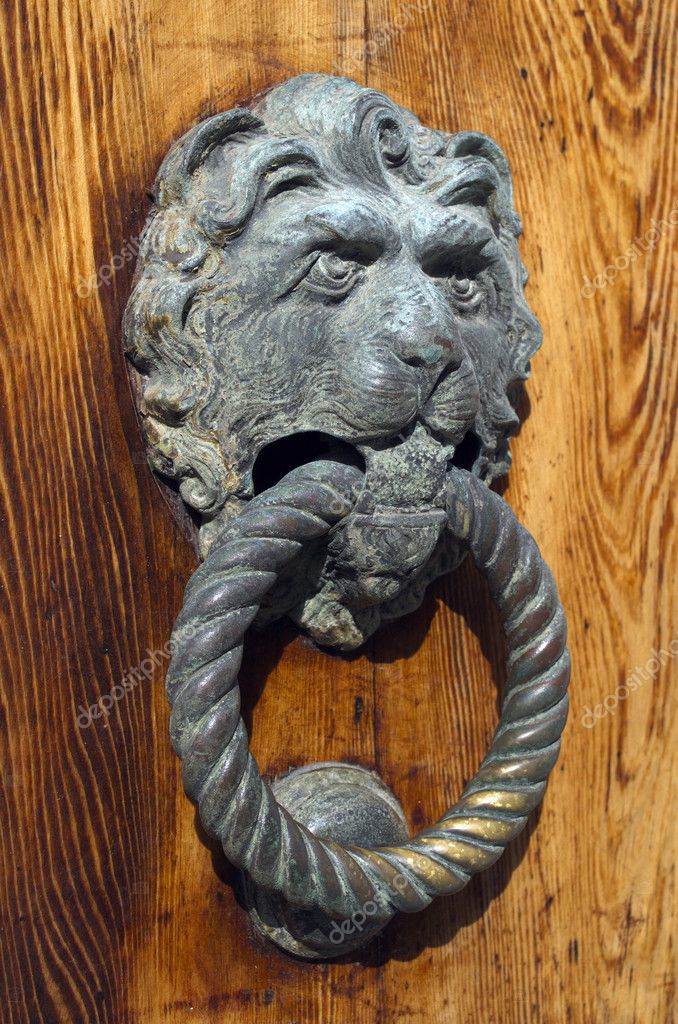 Gilded Lion Head Door Knob On The Wooden Door In Venice Stock