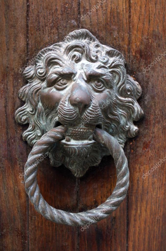 Gilded Lion Head Door Knob On The Wooden Door In Venice Stock