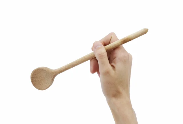Wooden spoon in hand — Stock Photo, Image