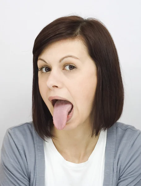 Sticking out tongue — Stock Photo, Image