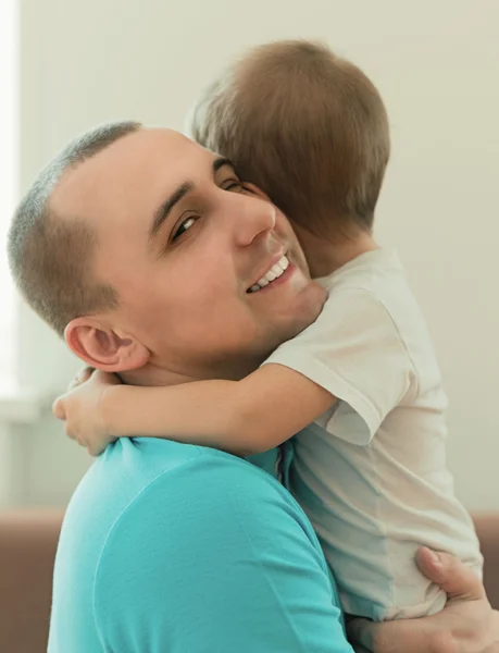 Happy father hugging her son — Stock Photo, Image