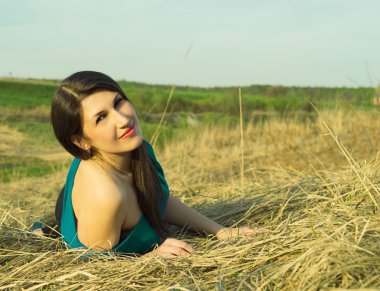 Portrait of a beautiful woman in the summer on the nature