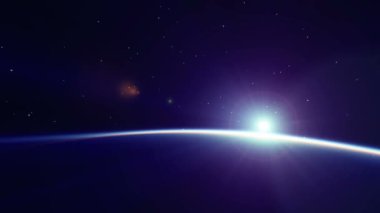 Uzayda gün doğumu. Dünya 'nın üzerinde yükselen güneş