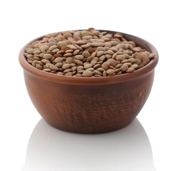 Bowl of dried brown lentils — Stock Photo, Image