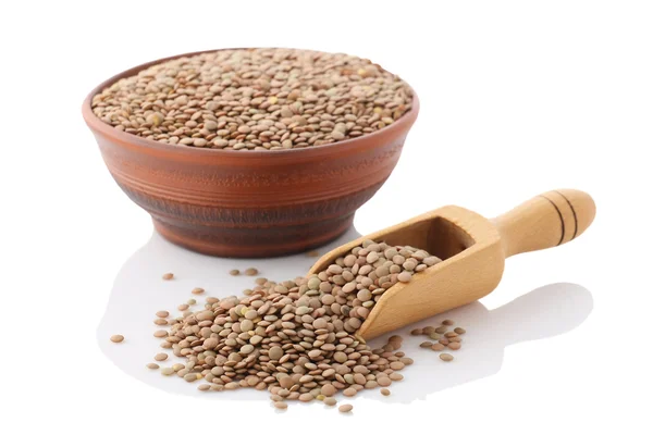 Bowl of dried brown lentils — Stock Photo, Image