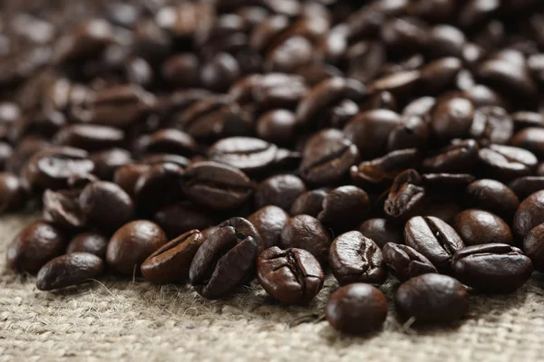 Coffee beans on cloth sack — Stock Photo, Image