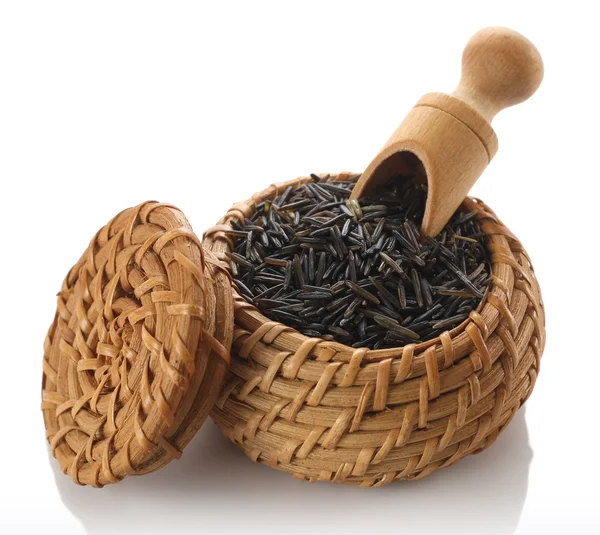 Wild rice in a wicker basket — Stock Photo, Image