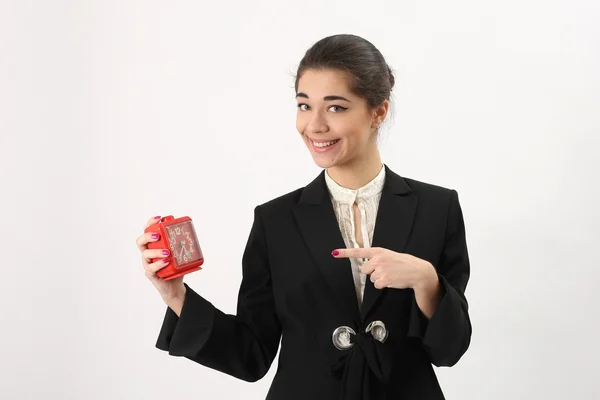 Donna d'affari sorridente con allarme in mano — Foto Stock