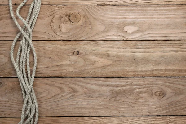 Cuerdas sobre fondo de madera —  Fotos de Stock