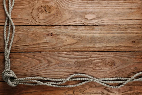 Corde su uno sfondo di legno — Foto Stock