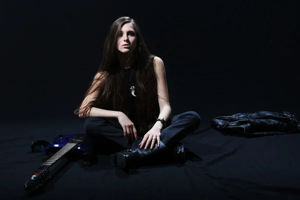 Female rock star playing the guitar