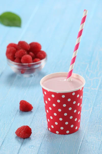 Raspberry yogurt cup with a straw — Stock Photo, Image