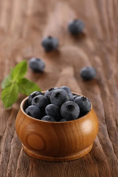 Blueberries in a wooden bowl — Stock Photo, Image