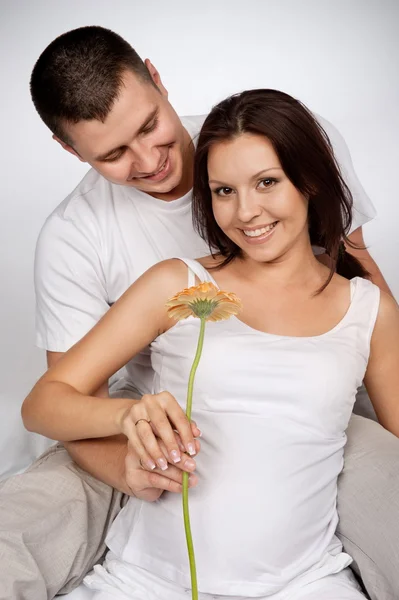 Portrait of young pair pending the kid — Stock Photo, Image