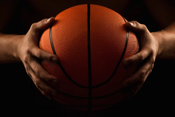 Basketball ball in male hands — Stock Photo, Image