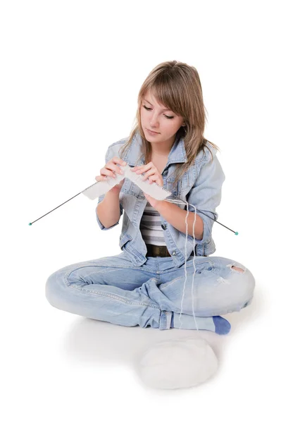 Young girl knits on spokes — Stock Photo, Image