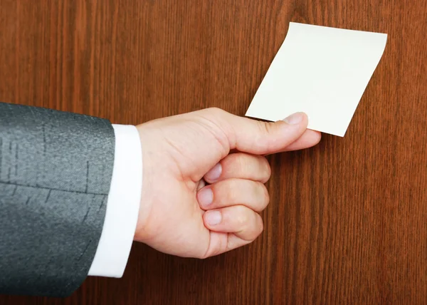 Man tears off sticker — Stock Photo, Image