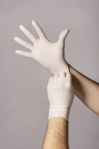 Oděv, gumové rukavice na rukou — Stock fotografie