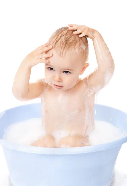 Little boy bathes in a bath with foam — Stock Photo, Image