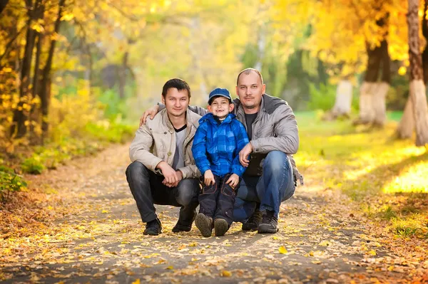 Family on a walk on a sunny autumn day — Stock Photo, Image