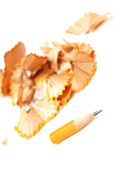 Sharpened pencil with chips — Stock Photo, Image