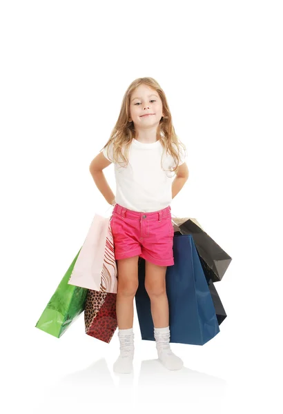 Dükkandan paketleri ile küçük kız — Stok fotoğraf