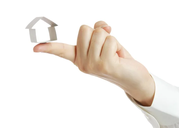 Small house from a paper in a hand — Stock Photo, Image