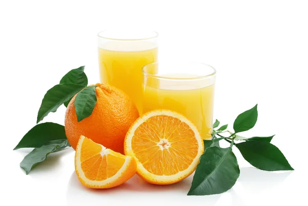 Orange juice and oranges — Stock Photo, Image