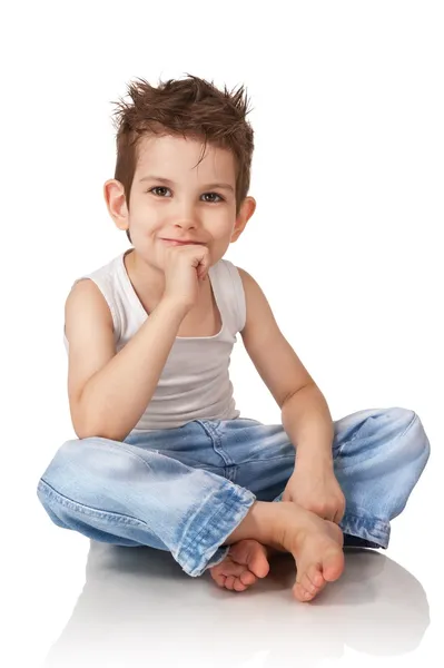 Niño sentado en jeans —  Fotos de Stock