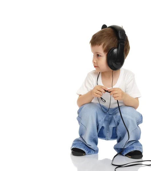 Kind in hoofdtelefoon — Stockfoto