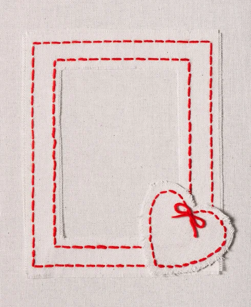 Embroidered frame with heart — Stock Photo, Image