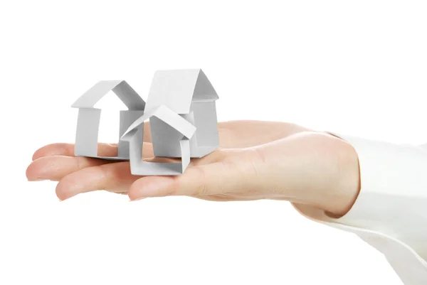 Small houses from a paper in a hand — Stock Photo, Image