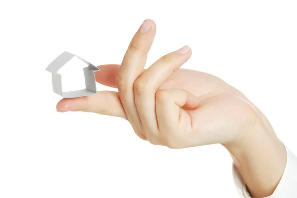 Small house from a paper in a hand — Stock Photo, Image