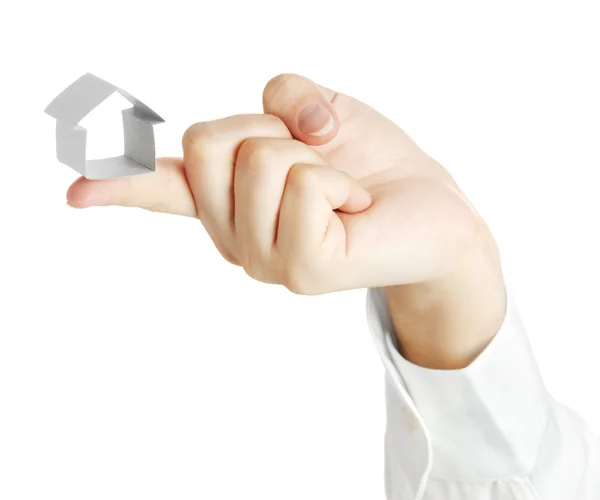 Small house from a paper in a hand — Stock Photo, Image