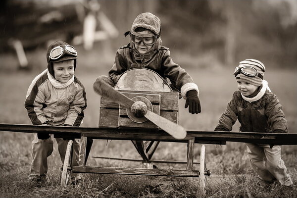 Aviators with handmade airplane