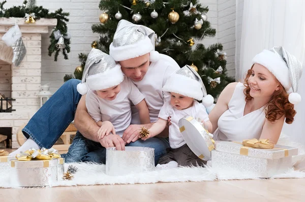 Family near Christmas tree — Stock Photo, Image