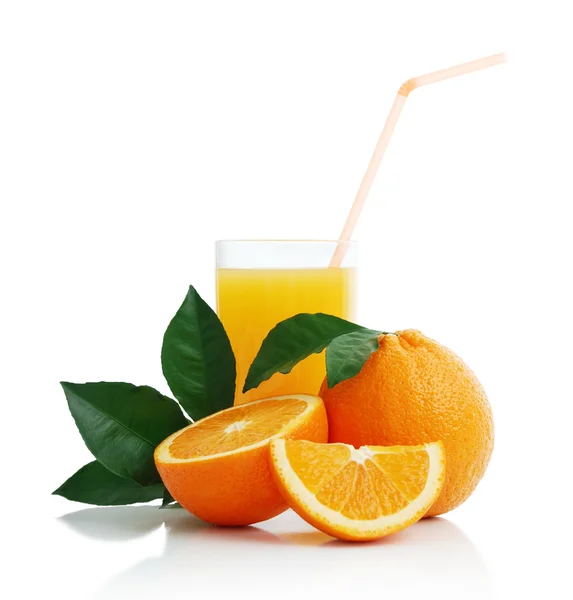 Orange juice and oranges — Stock Photo, Image