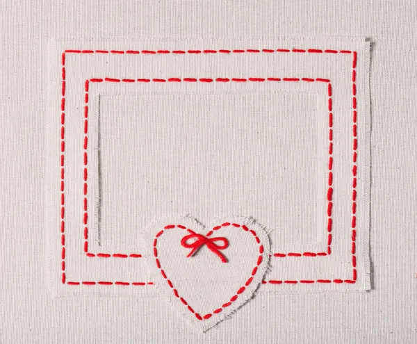 Embroidered frame with heart — Stock Photo, Image