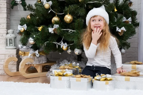 Girl with gifts under the Christmas tree — Stock Photo, Image