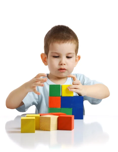 Boy plays with cubes Stock Image