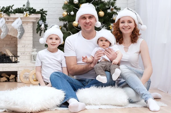 Family near Christmas tree — Stock Photo, Image